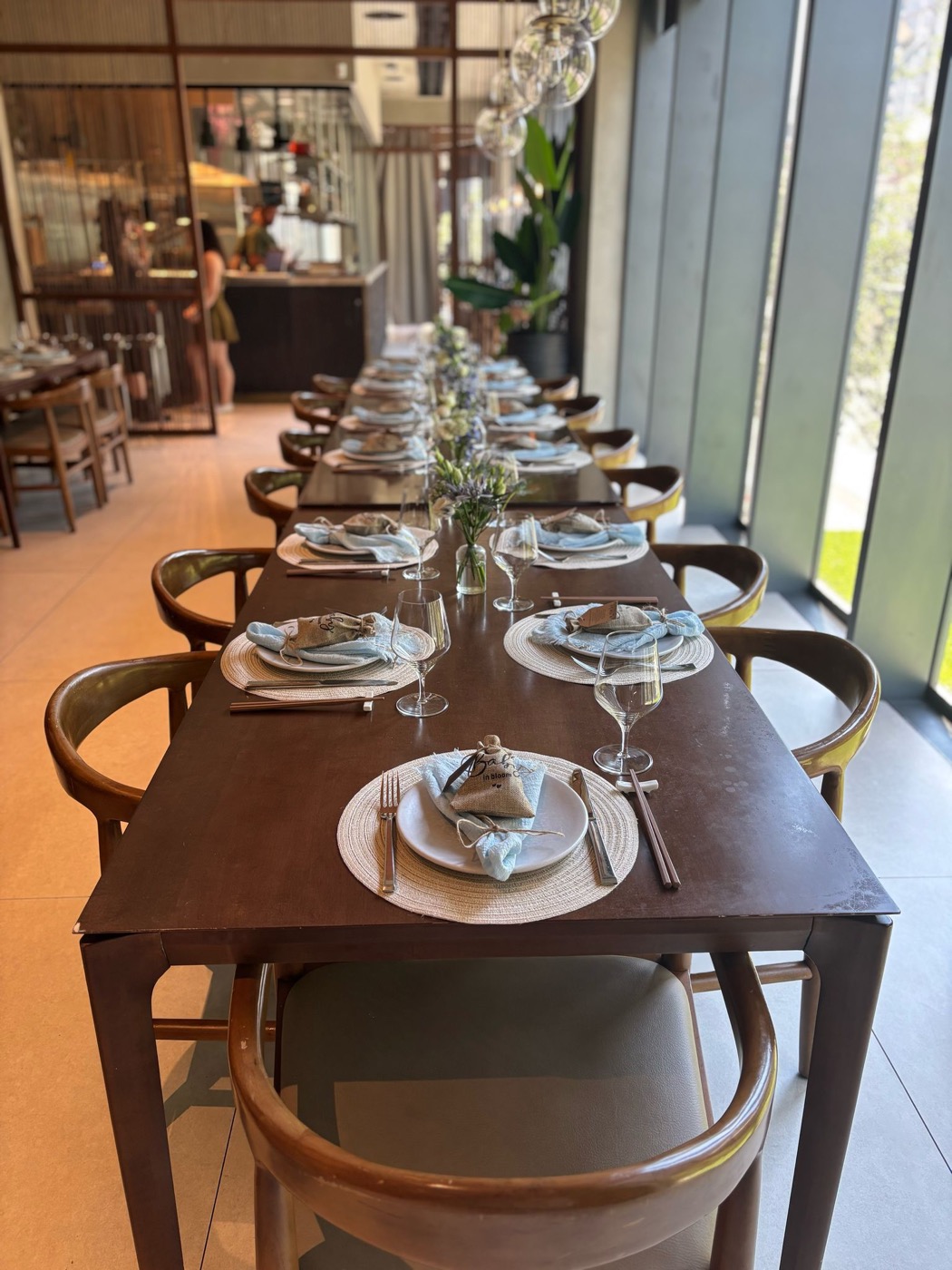 Long dining table styled for an intimate private event